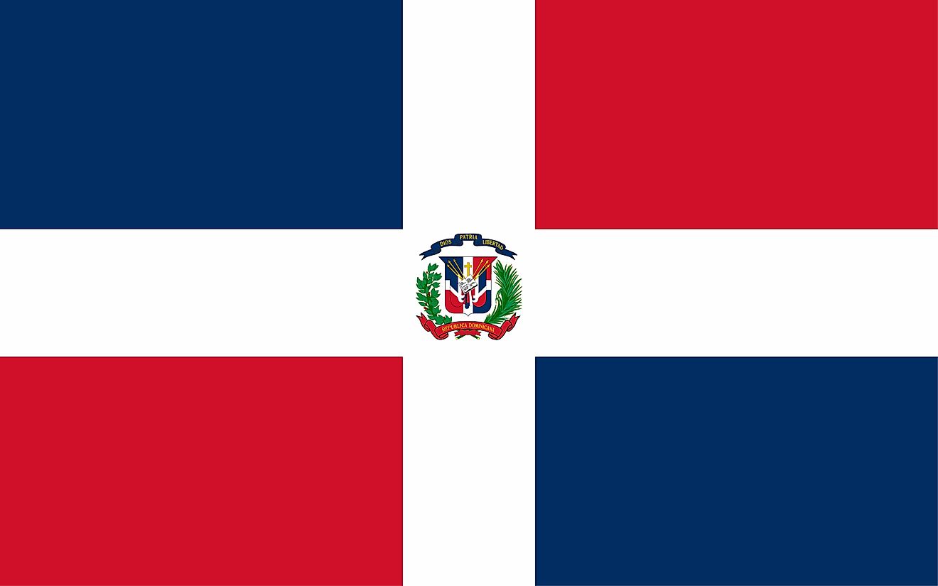 The National Flag of The Dominican Republic comprises a centered white cross that extends to the edges and divides the flag into four rectangles of blue and red.