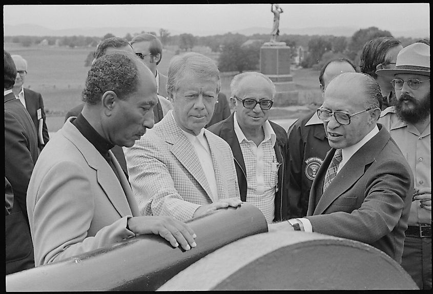 More details Anwar Sadat, Jimmy Carter and Menahem Begin examine a canon during a trip to the Gettysburg National Military Park.