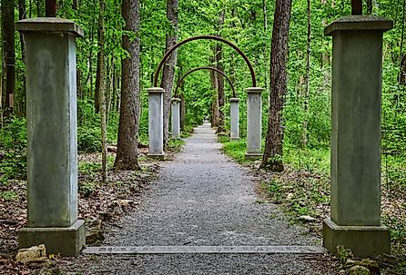 Row of concrete pillars and metal arches on Rose Island, Indiana